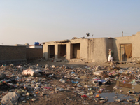 Keith and Jula Passing Through a Village in Kabul